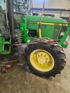 Torque tree in use on the front wheel of a John Deere 6410 with a torque wrench and extension